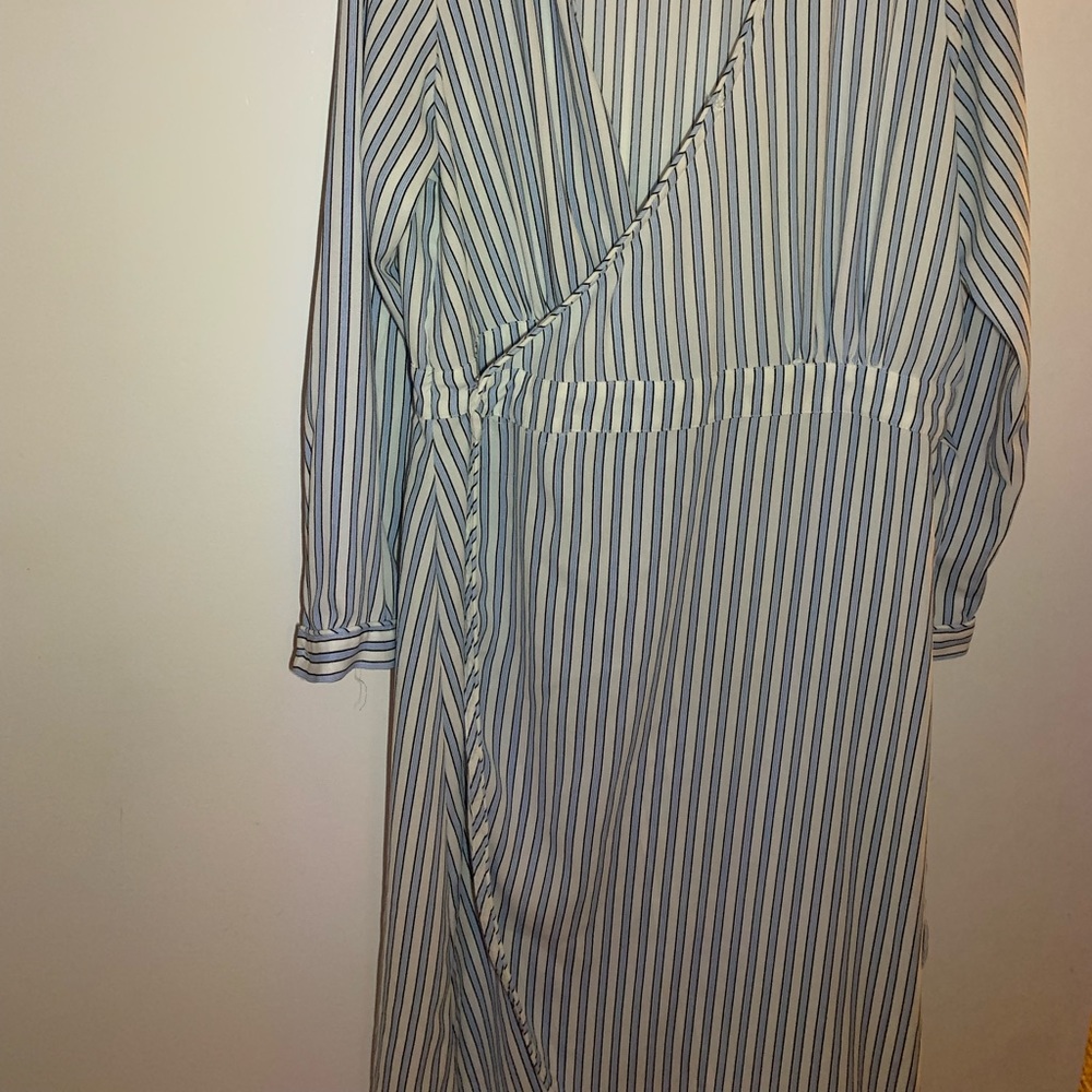 light blue and white striped dress with cleavage and a slit
